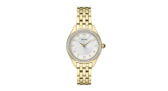 a yellow gold watch with a white dial and diamond studded bezel