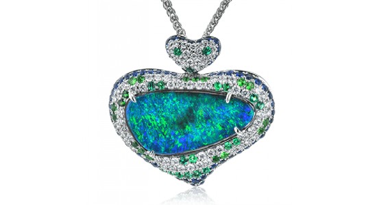 an asymmetrical pendant necklace featuring a blue and green opal and diamond accents.