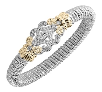 A sterling silver and yellow gold bangle features a diamond-adorned motif.