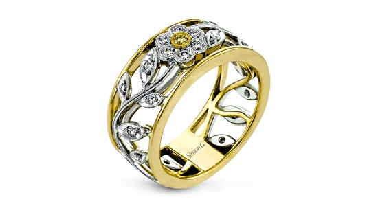 a mixed metal fashion ring with flower and vine details and a diamonds