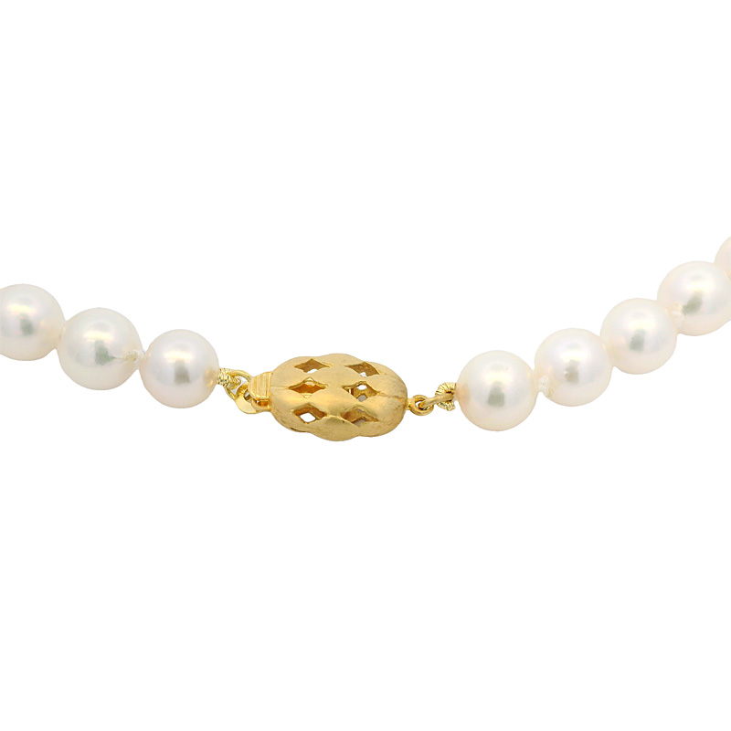 A pearl necklace with yellow gold clasp