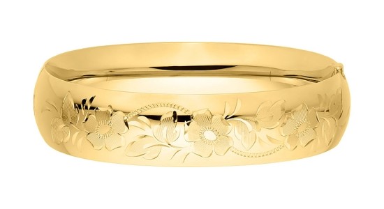 a yellow gold engraved bangle bracelet