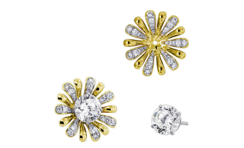 A pair of Spark Creation earring jackets with a floral motif, with one empty and the other with a diamond stud earring at its center, available at Bob Richards Jewelers. A pair of Spark Creation earring jackets with a floral motif, with one empty and the other with a diamond stud earring at its center, available at Bob Richards Jewelers.