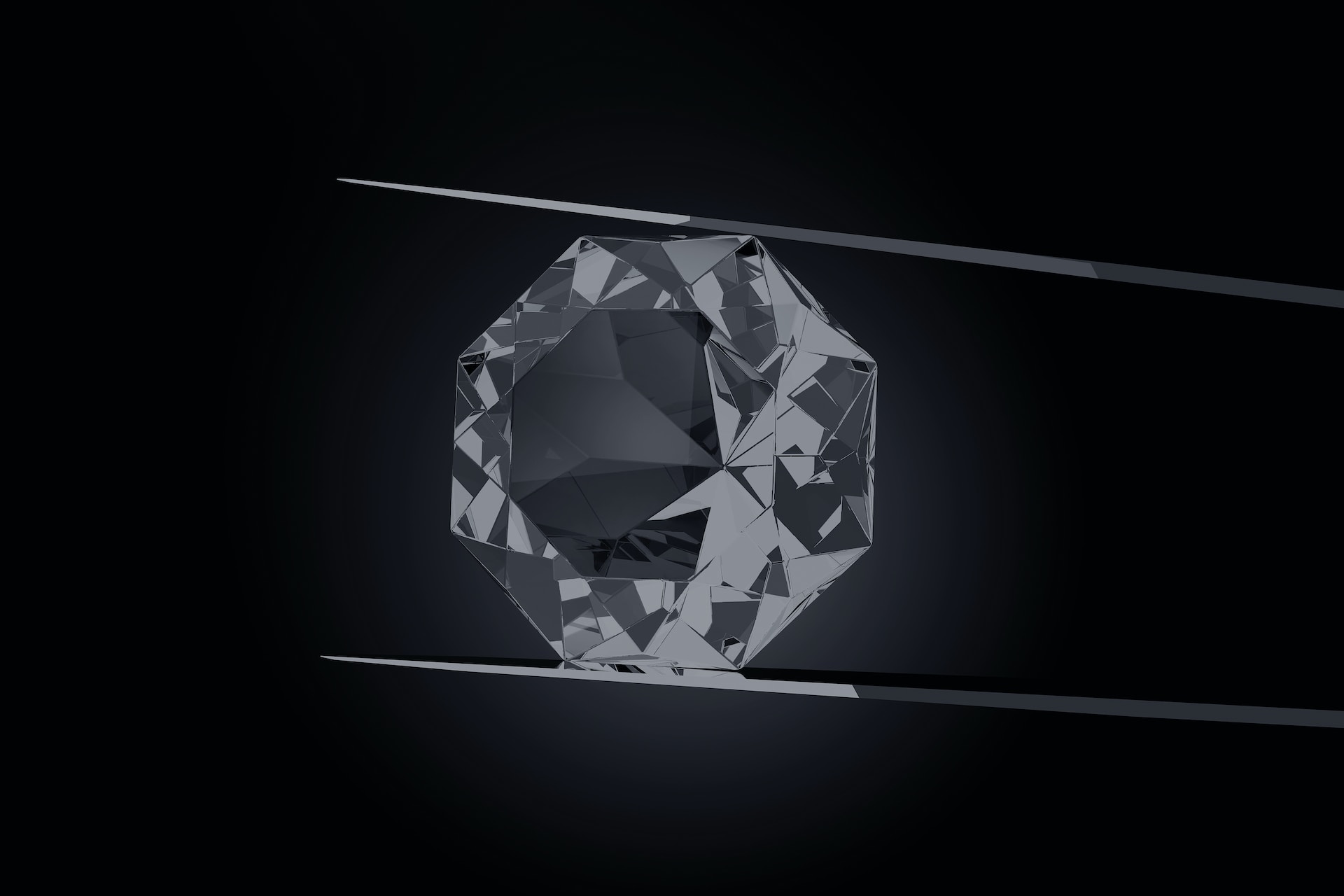 A diamond sits in a pair of fine tip tweezers.